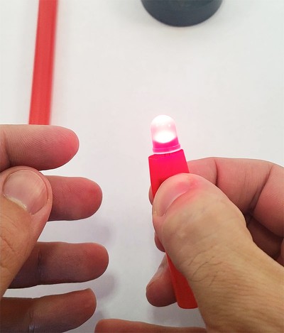 Squeezing the straw to light up the LED 
