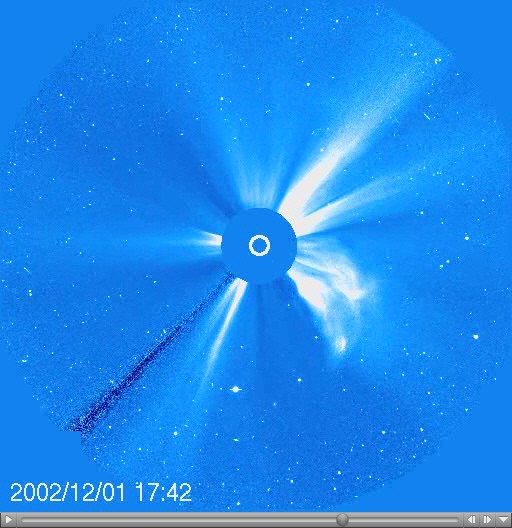 A coronagraph shows a large white flare emerging from the surface of the Sun with a timestamp of 2002/12/01 17:42