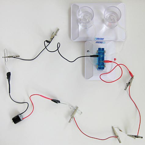 Wires connect a small motor to a reversible fuel cell