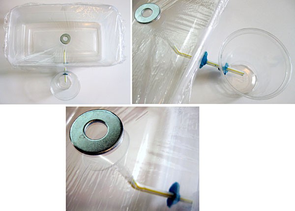 Saran wrap is placed over a plastic container and a washer is used to create a low spot over a funnel within the container