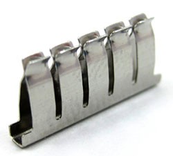 A row of five breadboard spring clips