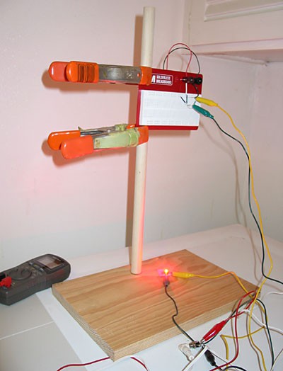 Photo of a red LED shining beneath a light-to-voltage converter