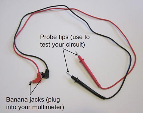 A red and black pair of multimeter probes have a probe tip on one end and banana plugs on the other