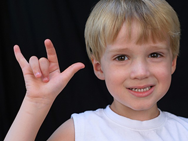Child doing sign language