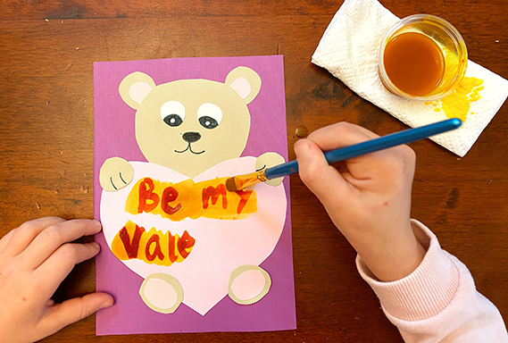 Valentine written with invisible ink and being revealed with a brush and solution