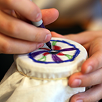 Example of marker tie dye pattern being drawn on part of a t-shirt