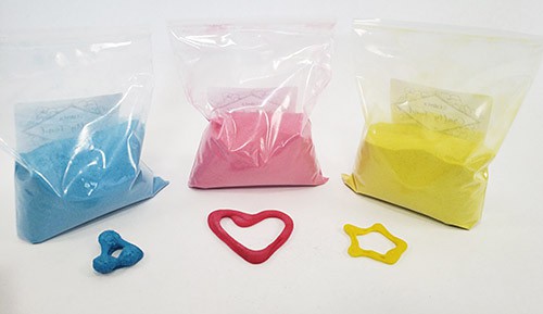 Three colored bags of sand and 3D printed shapes