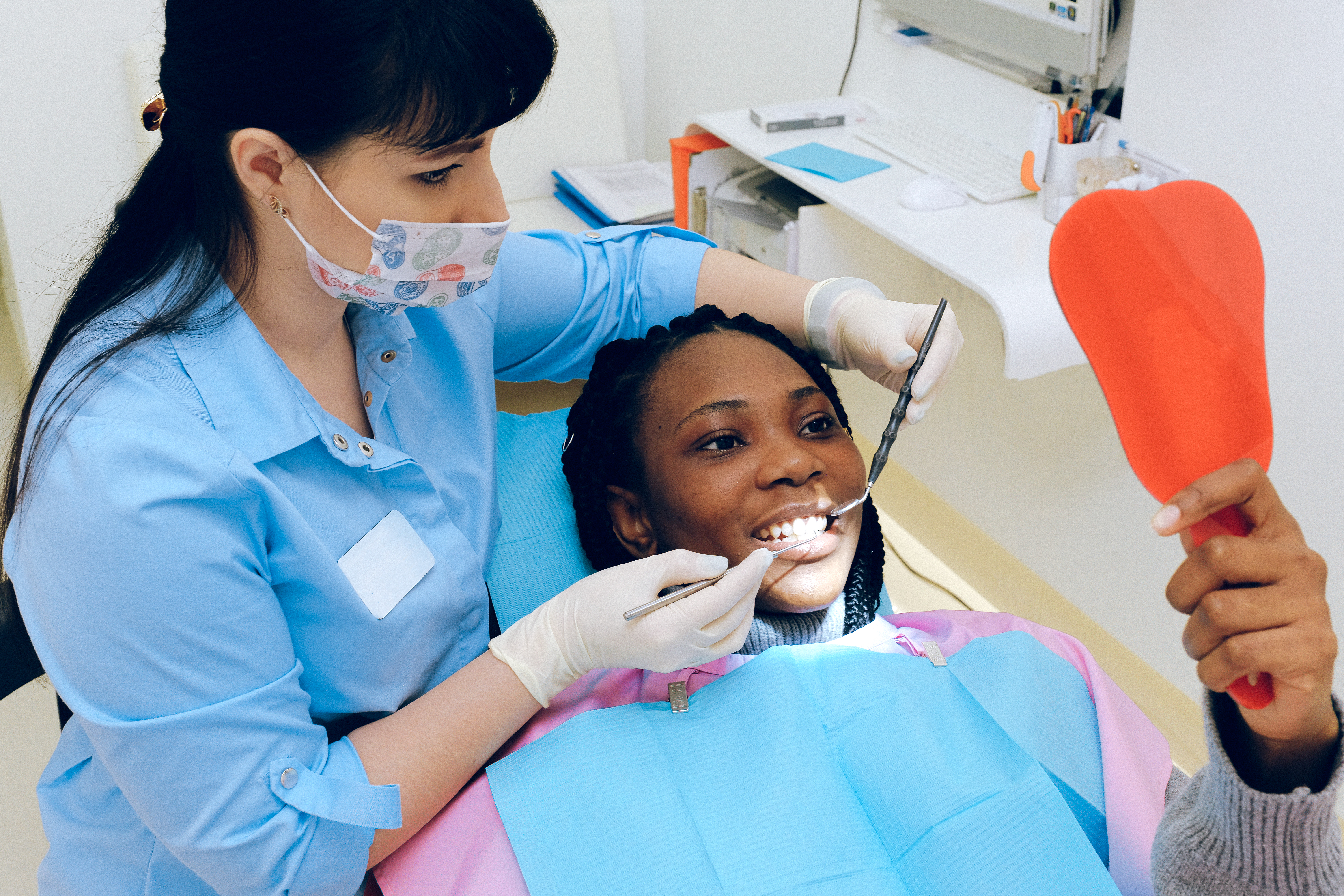 dental hygienist cleaning teeth