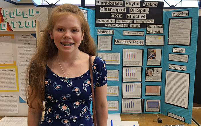 Student success story - student with project display board