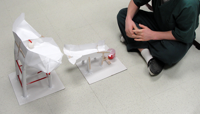 Student in Lucinda Mills class working on the Fluor Engineering Challenge volleyball machine