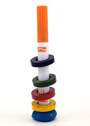Three colorful magnets floating above the bottom magnet on a marker.