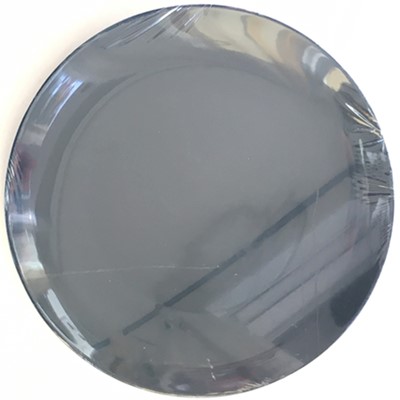 Ceramic plate with plastic wrap stretched over it.