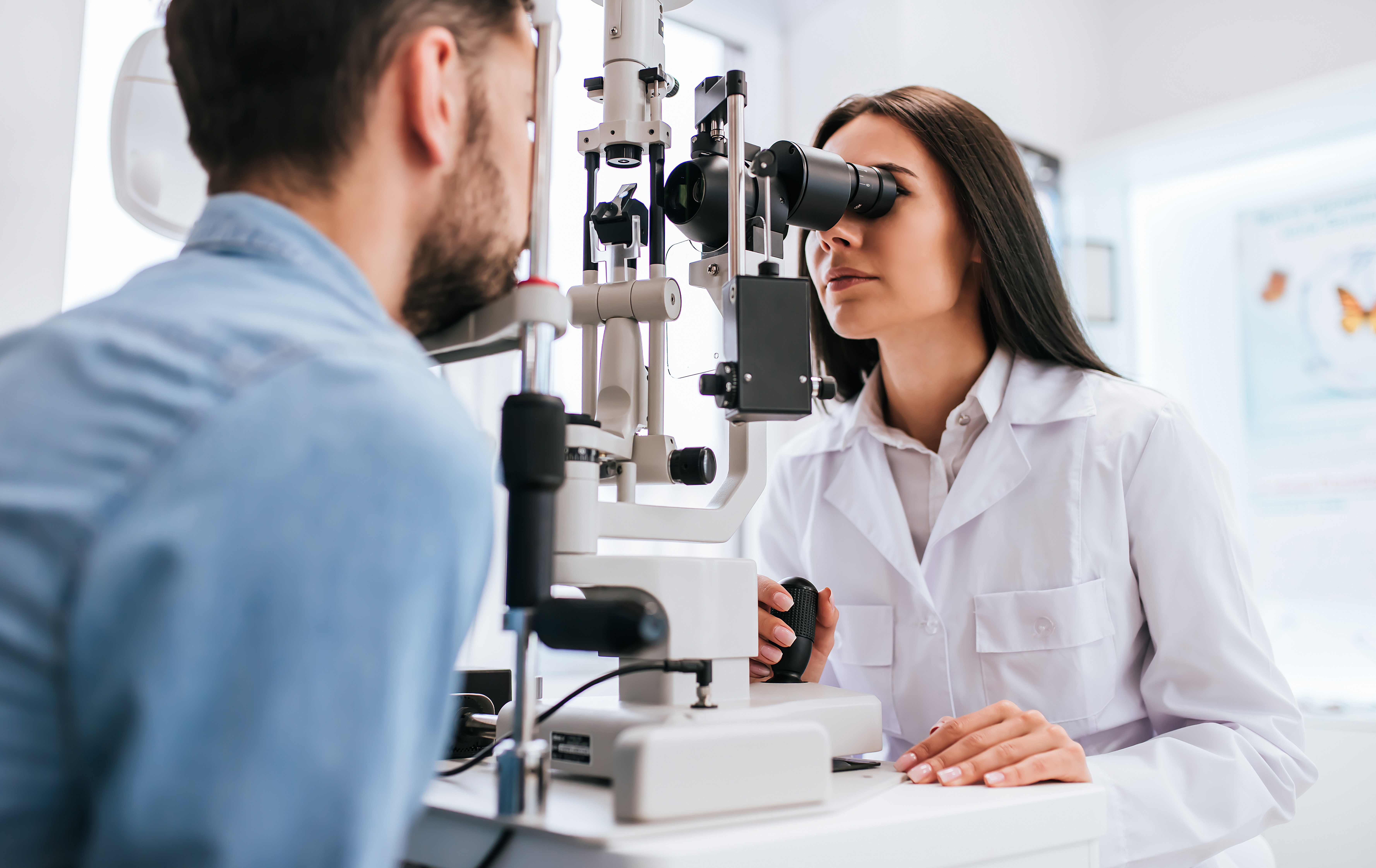 optometrist conducting eye exam