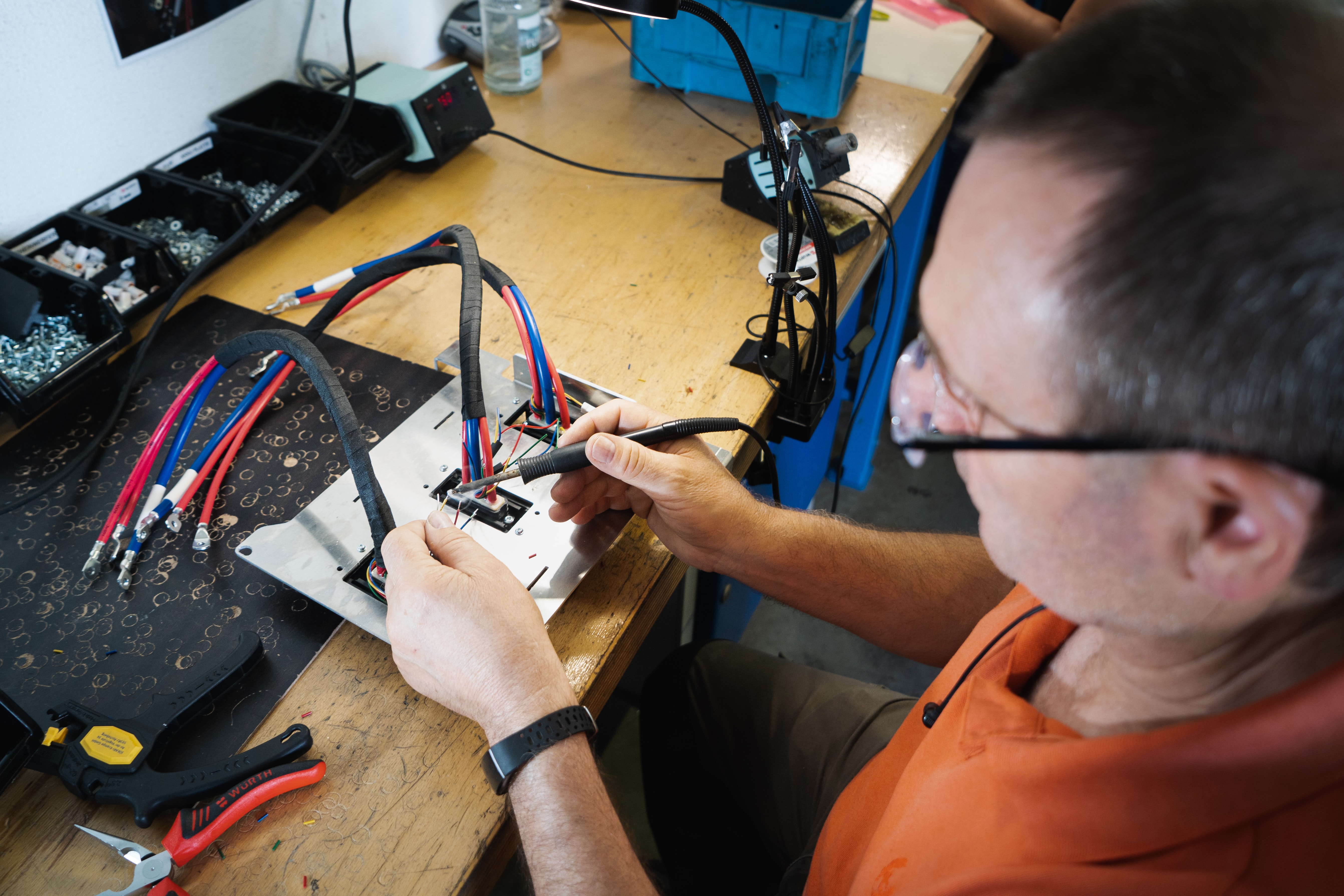 precision instrument repairman working on watch parts
