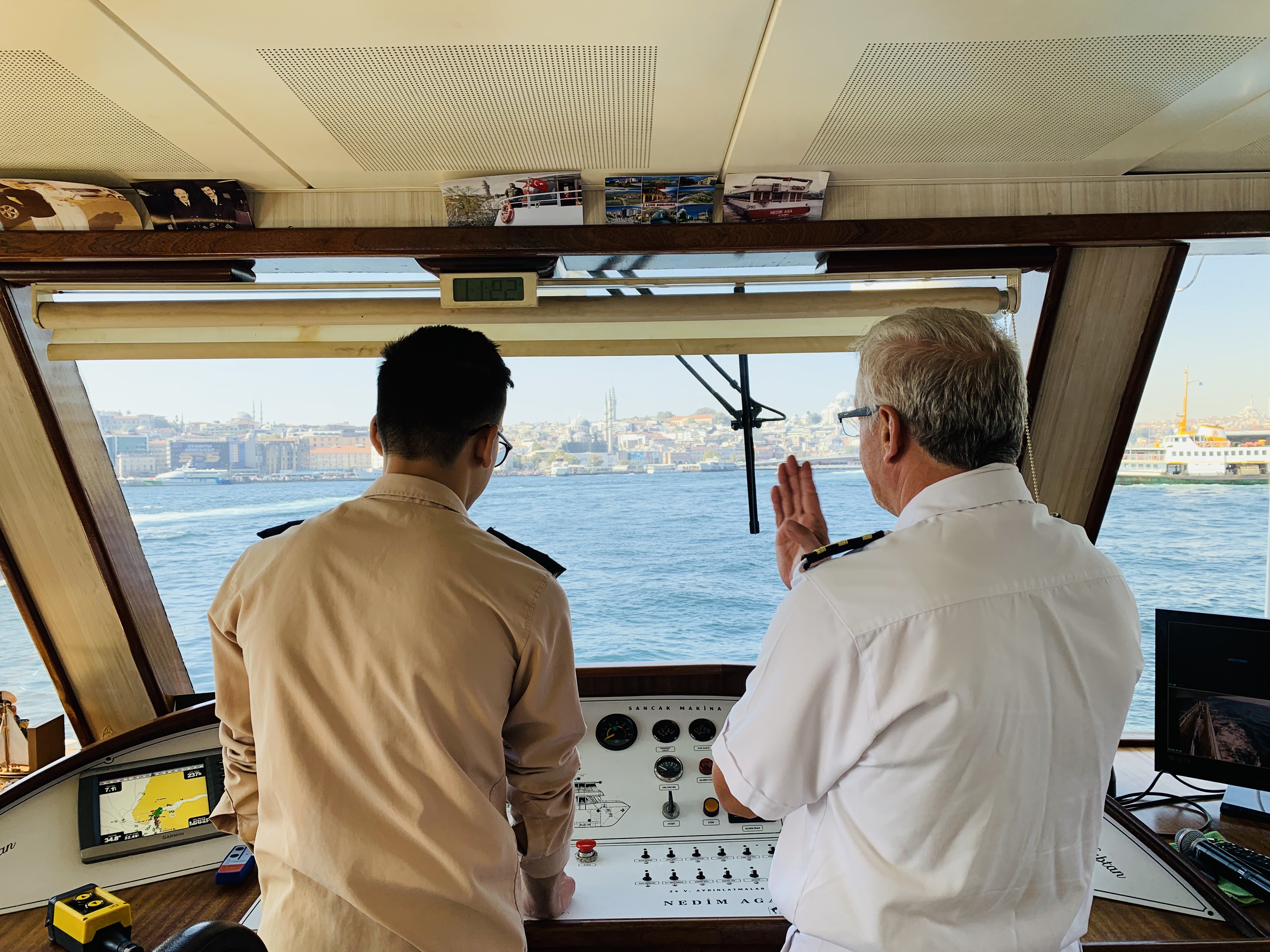 ocean liner captain at boat helm