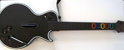 A plastic guitar used to played the game Guitar Hero on the Xbox 360