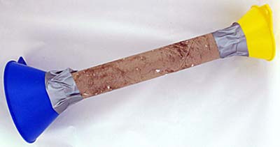 two funnels, one large and one small, together using a cardboard tube and duct tape.
