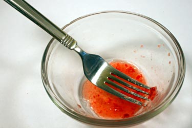 Mash strawberry with fork for DNA extraction
Biochemistry science project