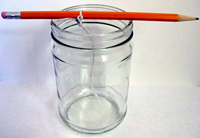 Chemistry science project Pencil with string tied to it, hanging in a jar.