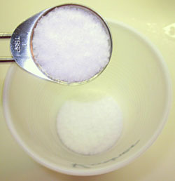 Measuring out tablespoons of salt