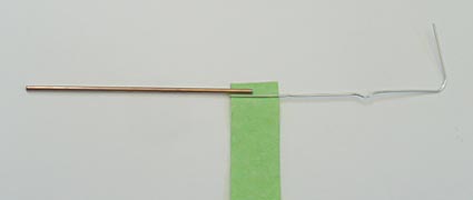 Connection of a paperclip unfolded into an L shape with the bendable iron core