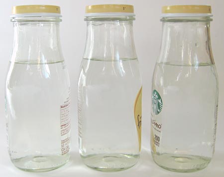 bottles with water partway