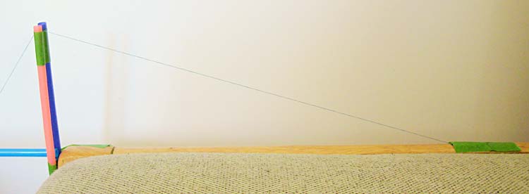 The right side of the suspension bridge, where the cable is taped to the furniture.