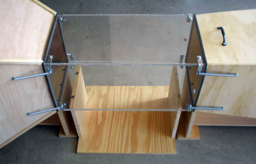 The three assemblies attached by springs.