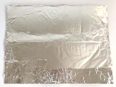 Cardboard sheet covered with aluminum foil.
