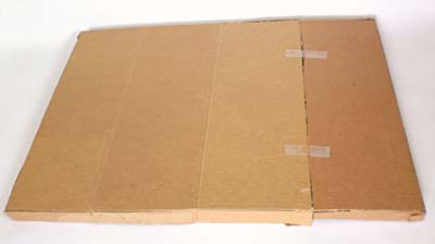 Sheet of cardboard cut to make a lid.