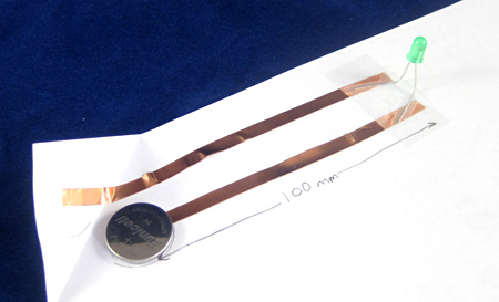 Paper circuit with coin cell battery and LED