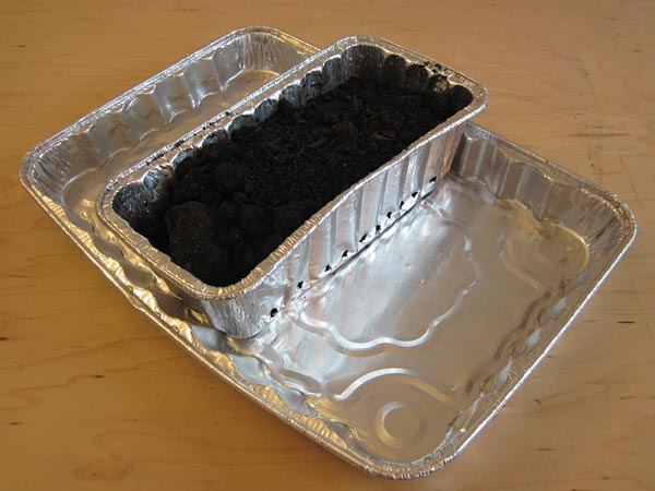 Soil in bread pan in cake pan