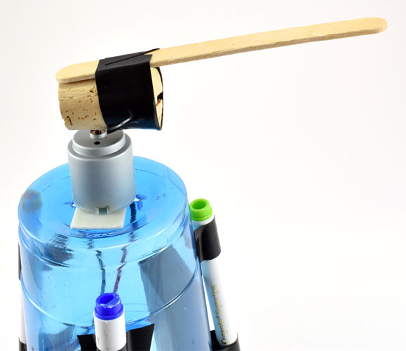 Tape popsicle stick to cork