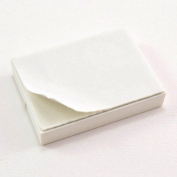 Peeling paper backing off breadboard