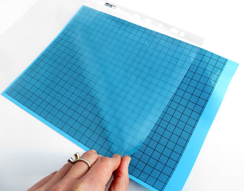Protect a sheet of millimeter graph paper.
