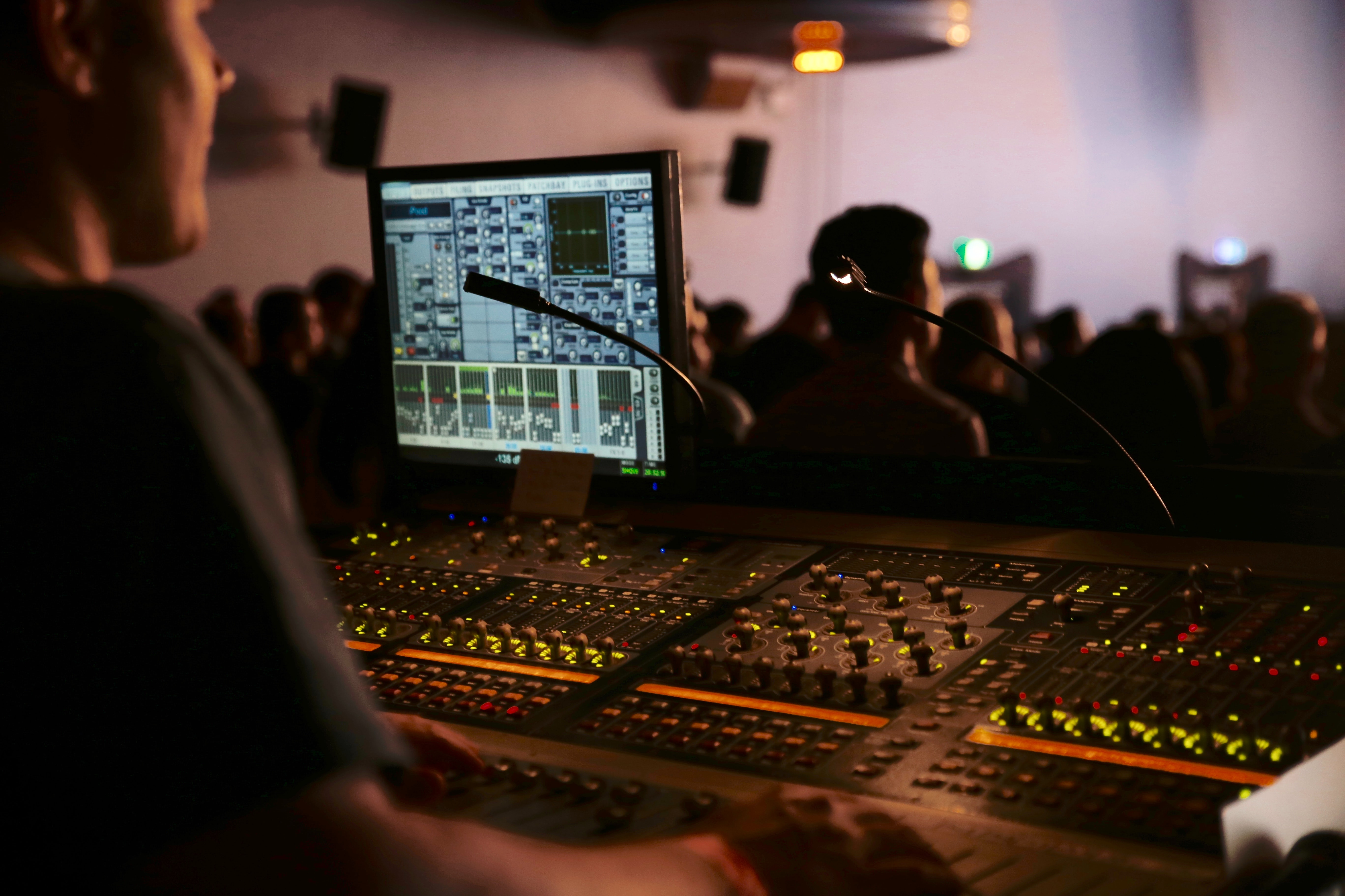 audio video technician getting audio equipment ready