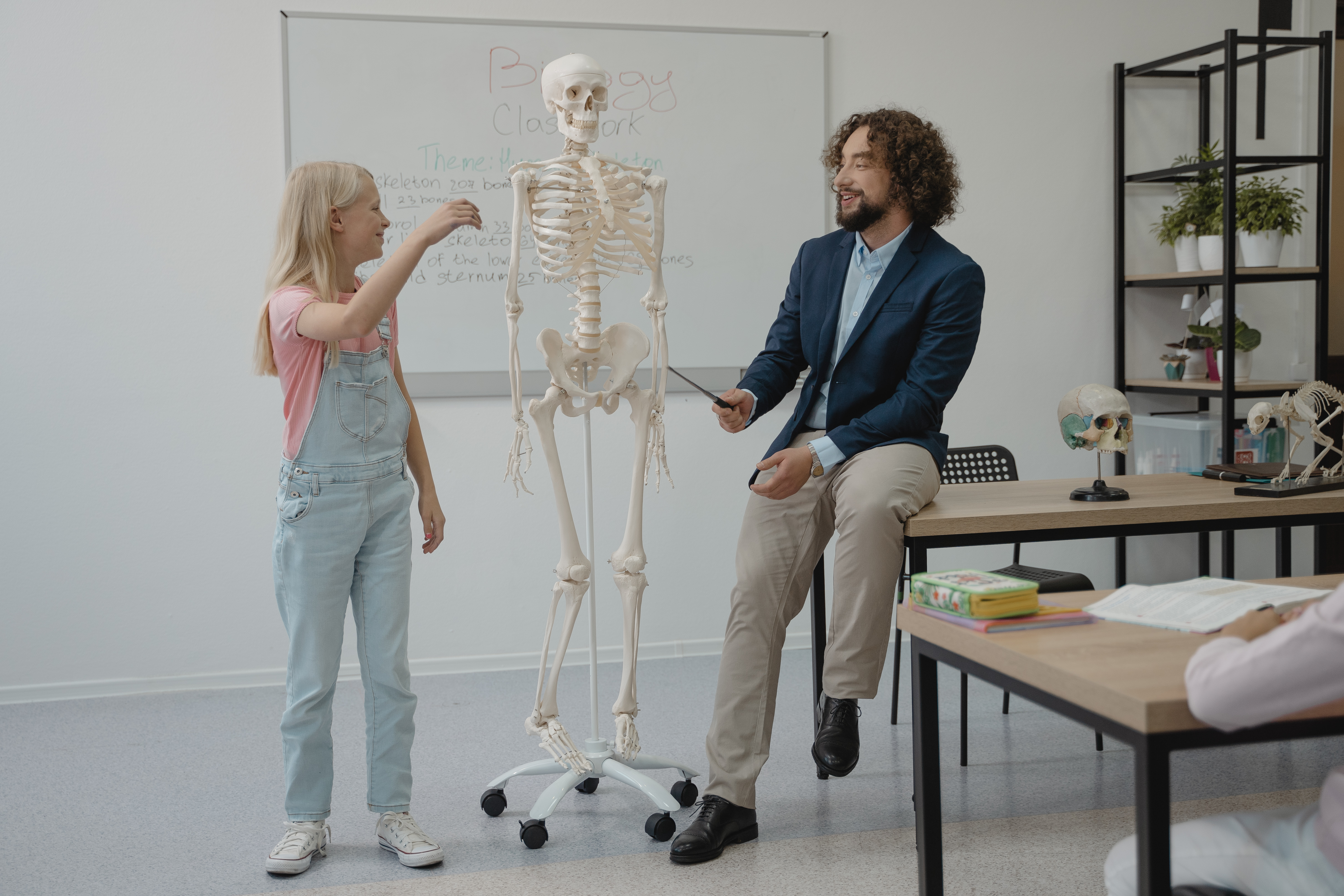 biology teacher showing students biotechnology lab techniques