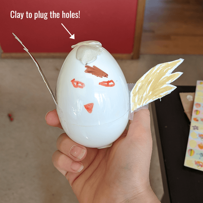 Example of how modeling clay was used to plug holes in the plastic egg
