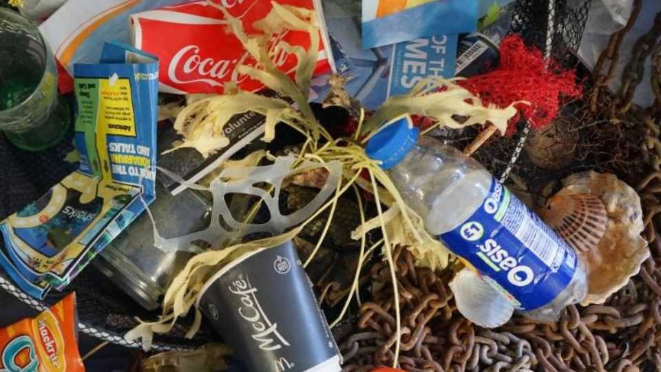 Trash piled up after a beach clean-up.