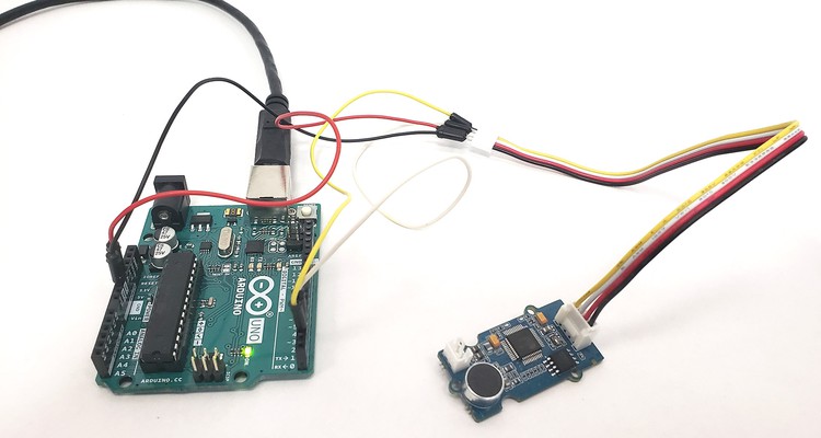 Grove speech recognizer board connected to the Arduino with a ribbon cable and jumper wires 