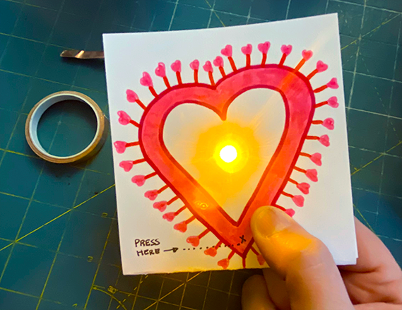 Paper circuit light-up card with an LED