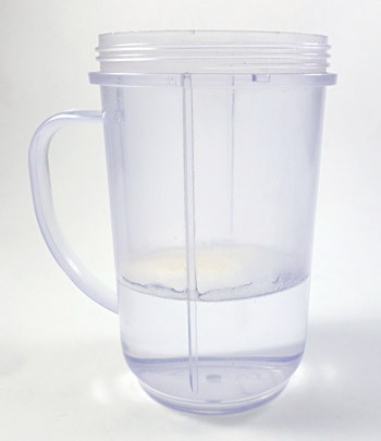 Sodium alginate is added to a blender cup filled with half a cup of distilled water
