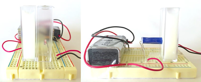 White light from an LED shines directly into a cuvette filled with milk on a breadboard