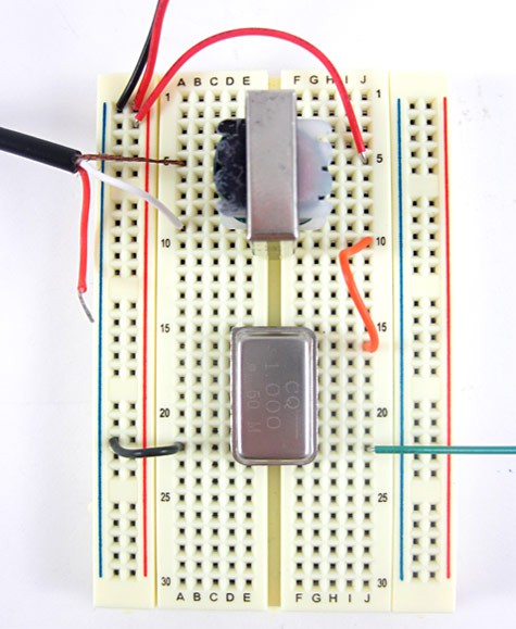 A fully wired breadboard for an AM radio transmitter