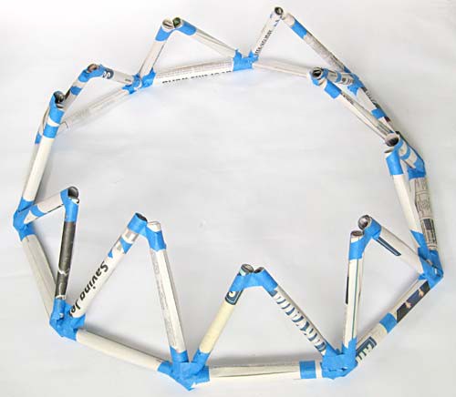 Long and short tubes combined to make standing triangles along a ring