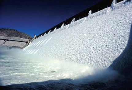 Water flowing through outlets of a dam