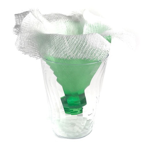 A cheesecloth and funnel drain into a glass cup