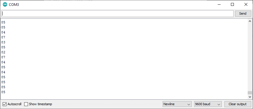 The Arduino serial monitor showing analog input readings, with 9600 baud selected.