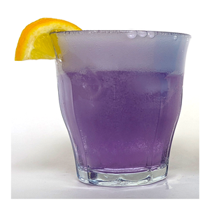 Glass of purple-colored lemonade that has fizzy bubbles at the top - Willy Wonka-inspired Make-Believe STEM Science Experiments