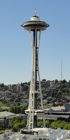 the space needle, a tall skinny tower with a hollow frame and circular observation deck at the top 